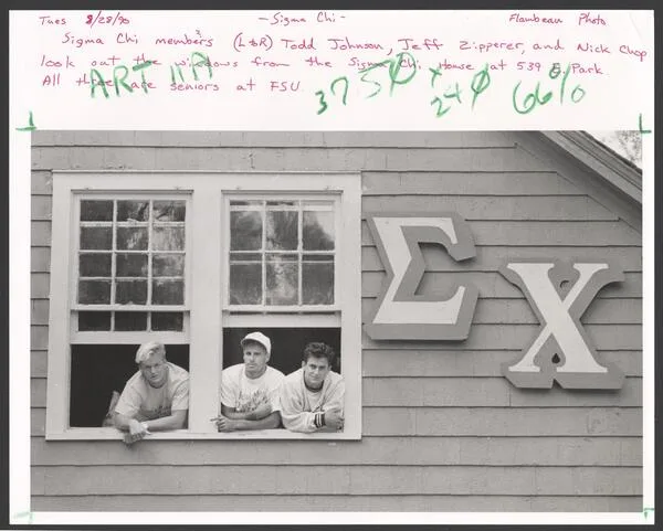 Brothers in Sigma Chi House window, 1990
