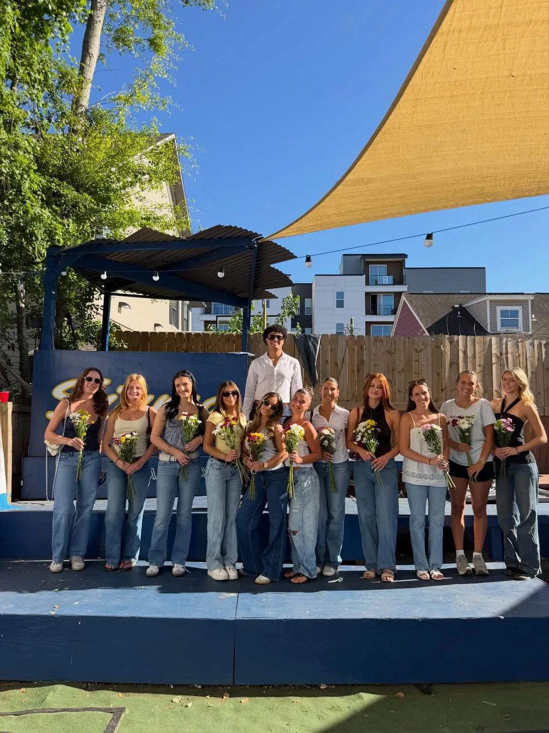 Sigma Chi Epsilon Zeta Derby Days Puppies and Pilates philanthropy event, sorority court with bouquets